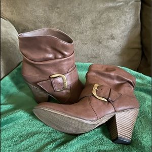Brown boots with buckle on side. Never warn